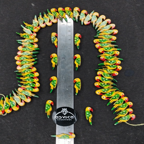 wooden parrots green and yellow