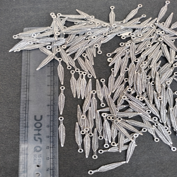 gold silver feather charm