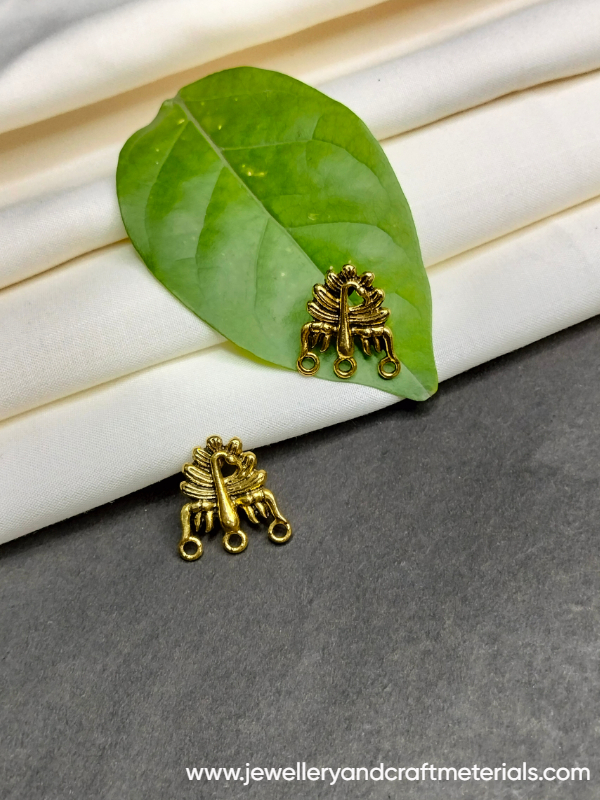 Golden peacock studd