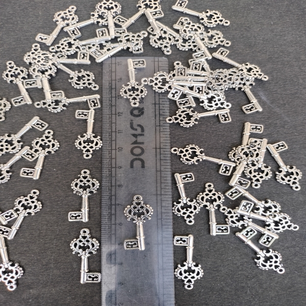 oxidised silver key pendant and charm